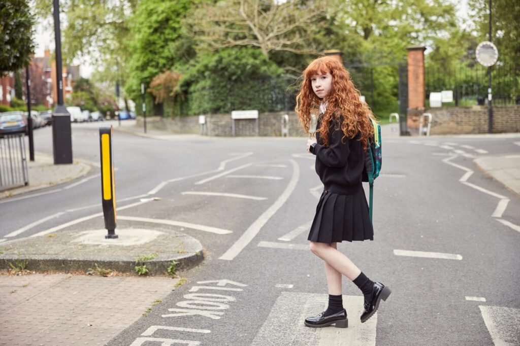 A girl crossing the street